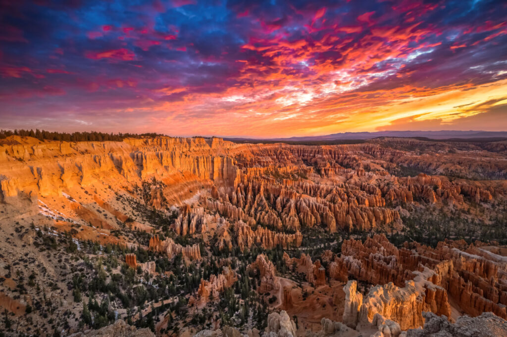 Step into the breathtaking beauty of Bryce Canyon National Park with this fine art, where the first light of dawn ignites the hoodoos in fiery tones of red, orange, and gold.